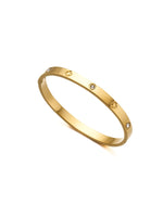 Gold bracelet with small diamonds on a white background