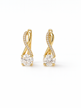 Gold earrings with clear gemstones on a white background