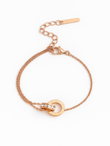 Rose gold bracelet with a heart clasp on a white background